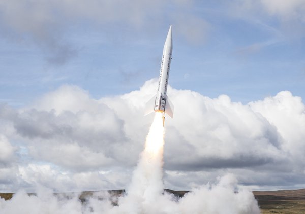 A rocket launches into the sky